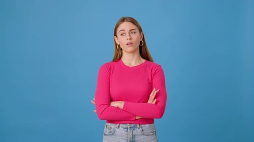 Female Getting Excited and Texting on Smartphone in Studio