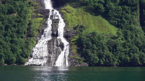 Amazing view of the Seven sisters waterfall in Geiranger, Norway. A powerful stream of raging whitew