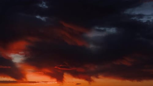 Moody Clouds Flowing During Sunrise Time-Lapse
