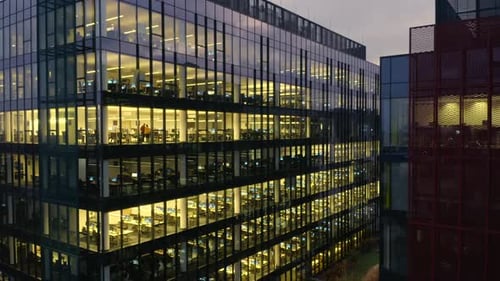 Aerial Panorama of LateNight Corporate Work in Glass Skyscraper Offices