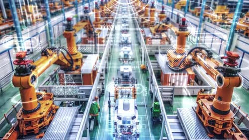 Brazos robóticos automatizados que ensamblan vehículos en una línea de ensamblaje