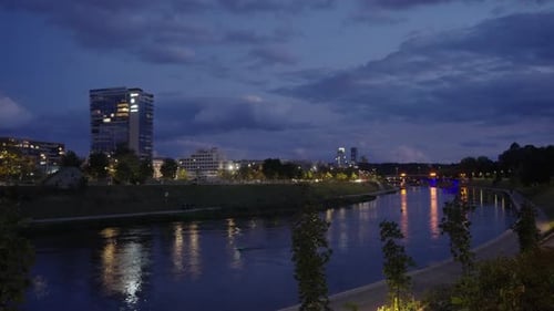 River Flowing Through City at Night