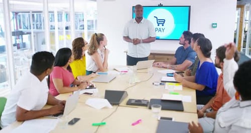 Diverse Team Meeting on Payment Technology in Office