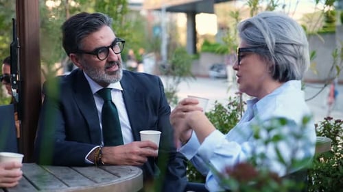 Business partners discussing during a coffee break
