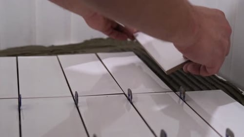 White Tile Installation in Bathroom Close-Up