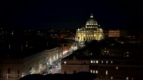 The Roman Catholic St. Peter's Basilica church lit up at night in the City of Rome, Italy. Static ha
