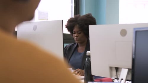 Woman Working on Computer in Modern Office
