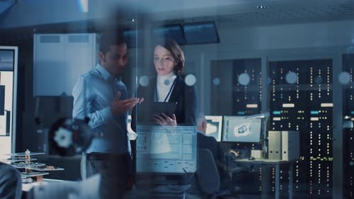 Engineers Reviewing Data on Transparent Computer Screen