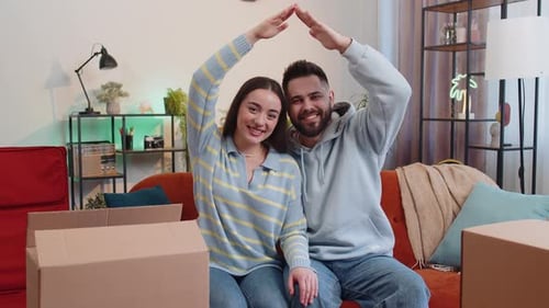 Young Family Man Woman Raise Hands Join Arms Together Making House Roof Shape Symbol of New Home