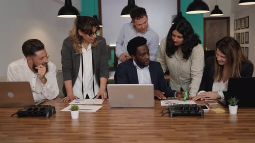 Business team of diverse people working together inside modern office