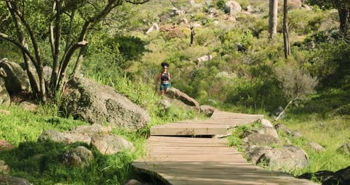 Trail runner, exercise and woman on mountain path for fitness, race training
