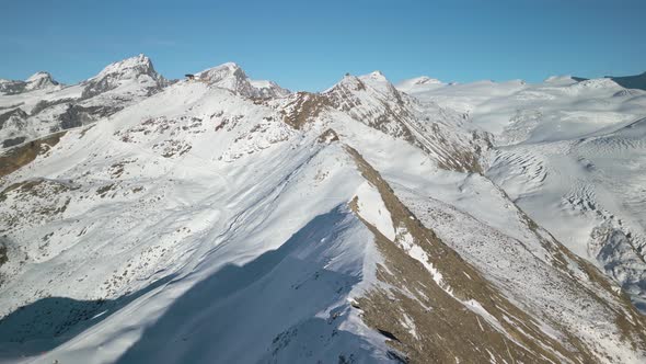 Beautiful Drone Flight Above Snowy Alpine Ridgeline. Snow on Left ...