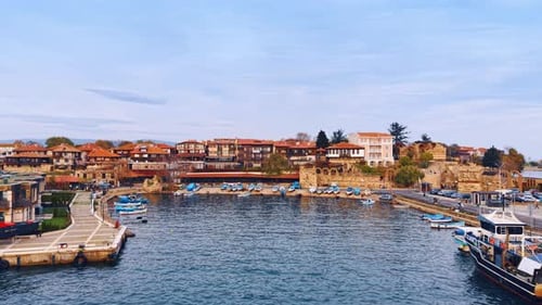 Approaching the cozy bay with multiple boats at the shore.