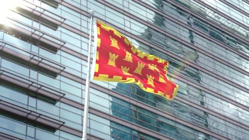 Realistic Waving Flag with Golden Castle Pattern Against Modern Building