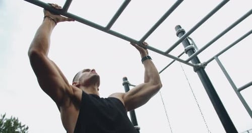 Sporty Guy Has Workout and Training Arms and Core Muscles at Sport Ground