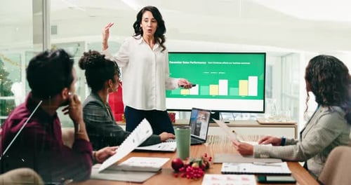 Business, people and finance presentation in office for christmas stats, KPI review and feedback
