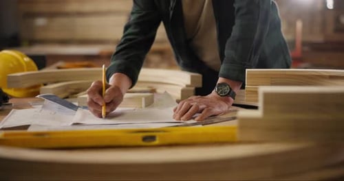Carpenter, hands and pencil with drawing for construction, furniture or project