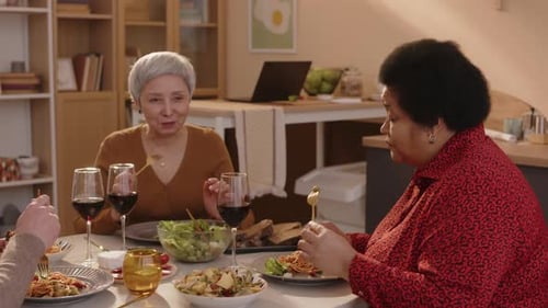 Friends Having Lunch Together at Dining Table