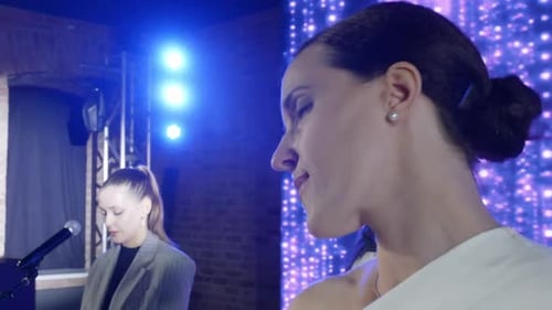 Musical Band Performance With Woman Singing On Stage