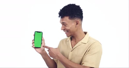 Man, pointing at phone screen and mockup, green screen and advertising with portrait isolated