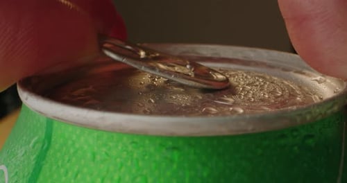 Opening Soda or Beer Can Macro Close Up of Can Pull Tab Opening Watering Refreshment Hand Open