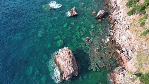 Aerial View of Picturesque Cliffs on the Sea Coast Washed By Crystal Clear Turquoise Water