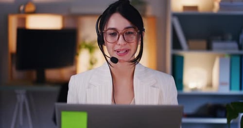 Cheerful Woman Conducts Video Call in Office