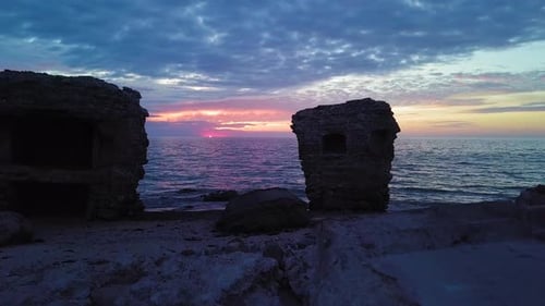 Beautiful aerial vibrant high contrast sunset over calm Baltic sea, dark storm clouds at horizon, Ka