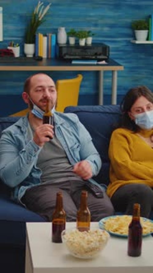Vertical Video Multiethnic Friends Looking at Tv Relaxing Spending Time Together