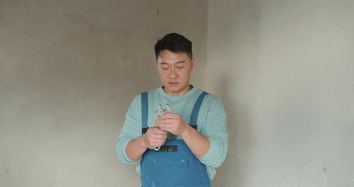 Handyman Worker Showing Up His Tools at Workplace