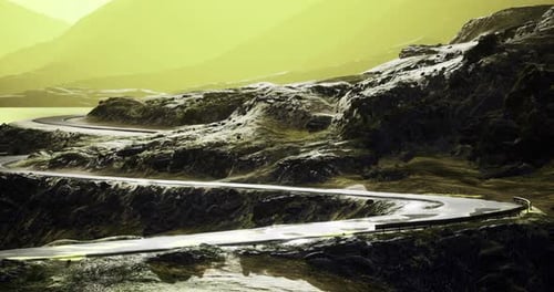 Curving Mountain Road Bathed in Luminous Yellow Light During Golden Hour