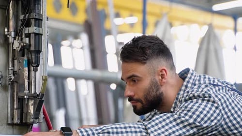 Smart Factory Worker Using Machine in Factory Workshop