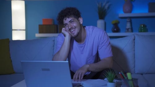 Young college student daydreaming at night.