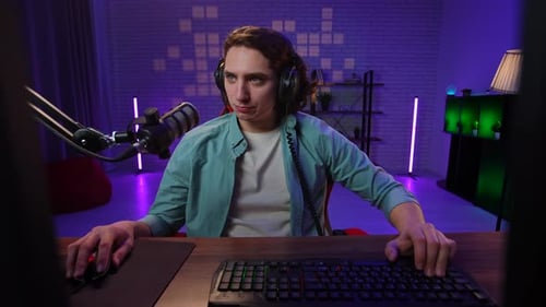 Young Adult Gamer Typing on Computer Keyboard