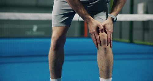 Person, legs or hands with knee pain for sport accident, mistake or muscle tension on tennis court