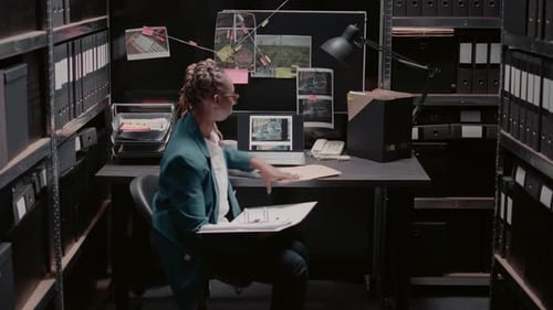 Woman Investigating in File Storage Room