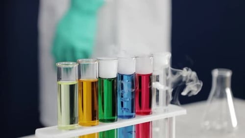 Test Tubes with Colorful Liquids and Smoke