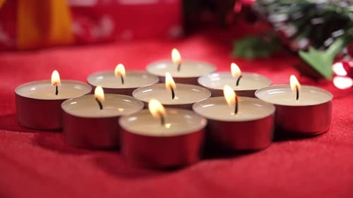Candles on Red Background for Christmas Religious Celebration