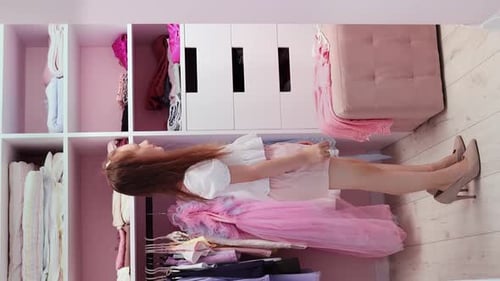 Girl Plays in Closet with High Heels