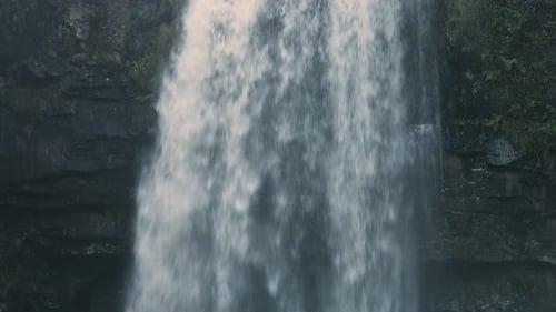 Dramatic Waterfall on Fast Flowing River in Wales UK