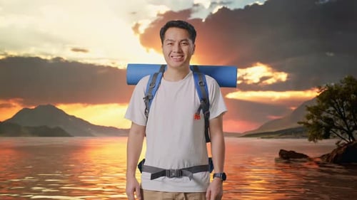 Asian Male Hiker Smiling To Camera At A Lake
