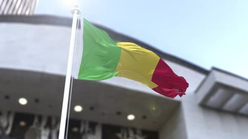 Mali National Flag Waving in Wind with Sunny Sky Background