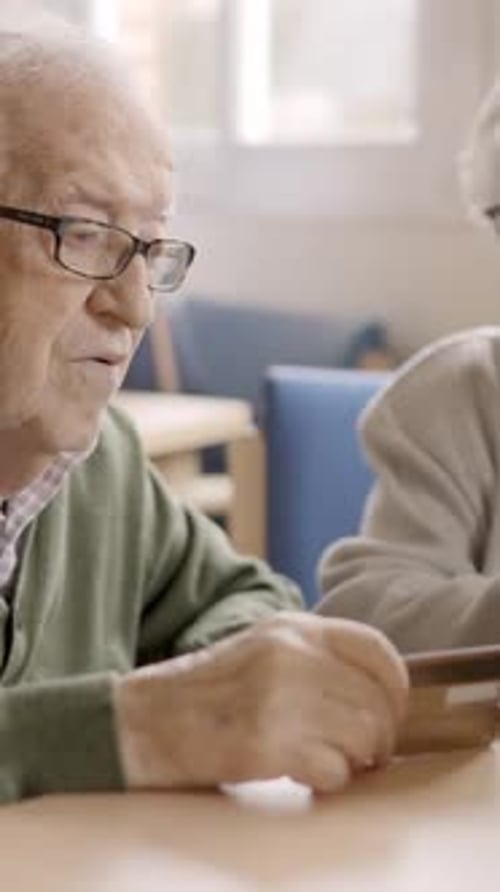 Senior People Trying to Shop Online with Laptop in Geriatric