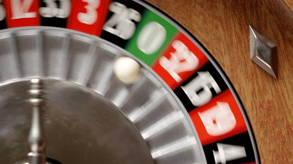 Macro shot of a roulette in a casino where the ball goes to the green ...