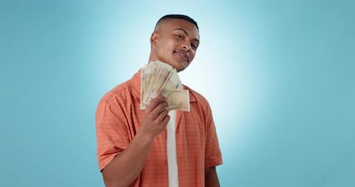 Cash, money fan and portrait of a man in studio as winner for competition, lottery or award