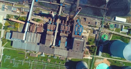 Aerial View of Coal Power Plant High Pipes with Black Smoke Moving Up Polluting Atmosphere at Sunny