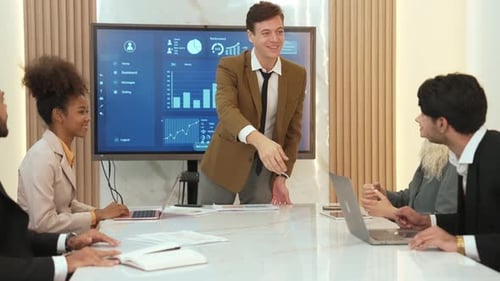 Business Team Meeting with Digital Display in Office