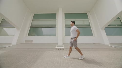 Young Guy in His 20s Wearing Casual Styled Clothes in Summer City Street