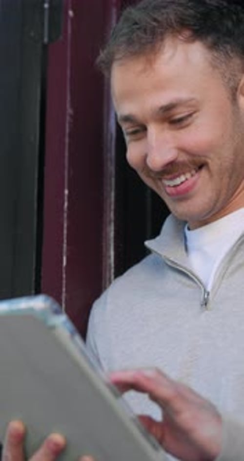 Tablet, typing and smile with man at cafe for menu option, entrepreneur website and contact