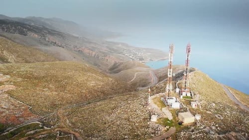 Island with communications tower on hill